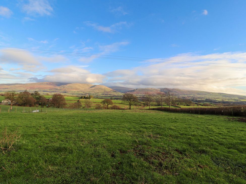 A scenic view of mountains and grassland at Hawkrigg Cottage Kirkby Lonsdale