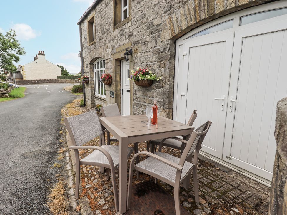 An outdoor space with a table and chairs at The Stables Horton-in-Ribblesdale near Settle