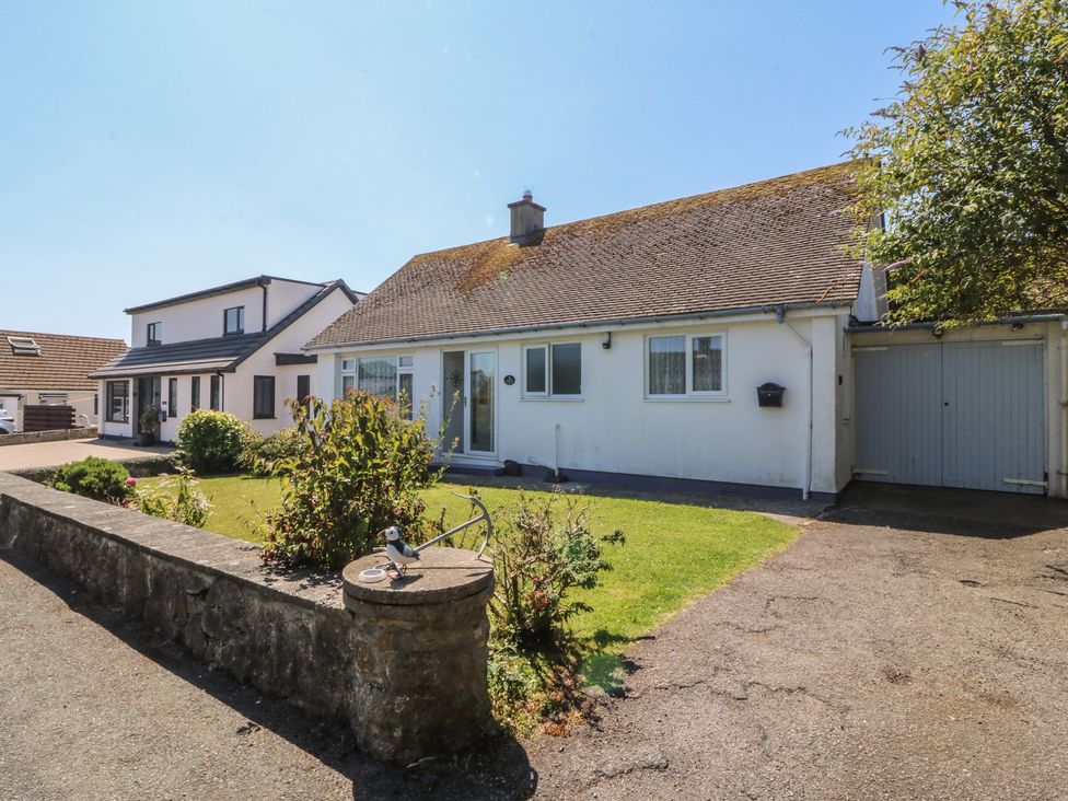 A house with a driveway and garden at Salty Puffin in Benllech