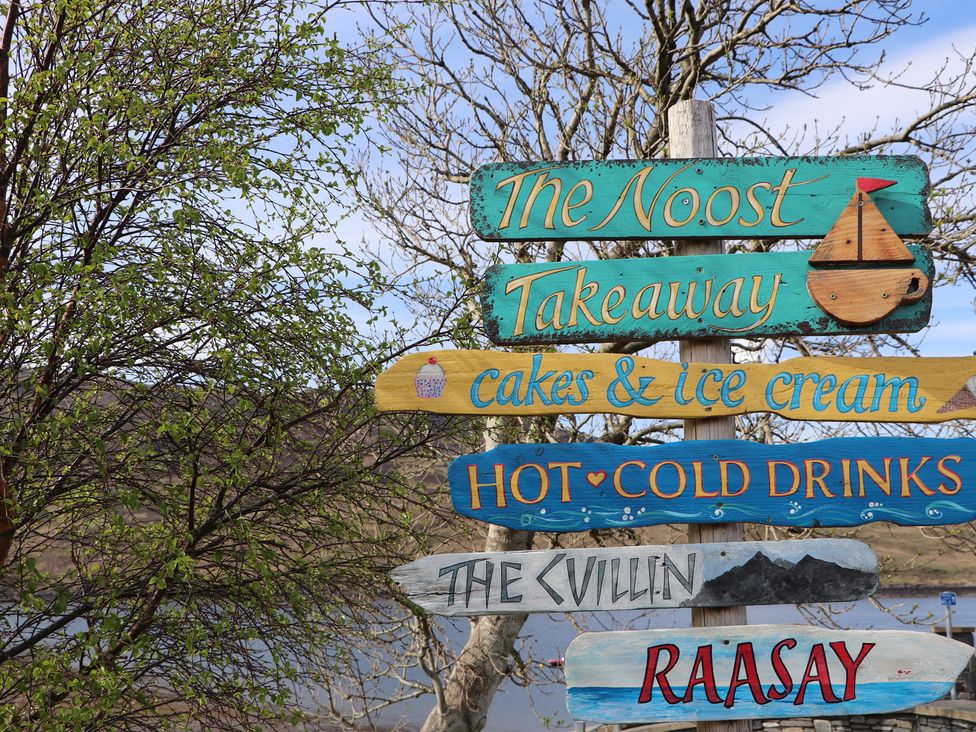 A signpost with various directions at MacKenzie’s Peak Sconser near Portree