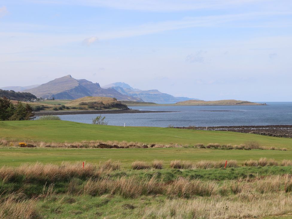 A landscape view with mountains and sea at MacKenzie’s Peak Sconser near Portree