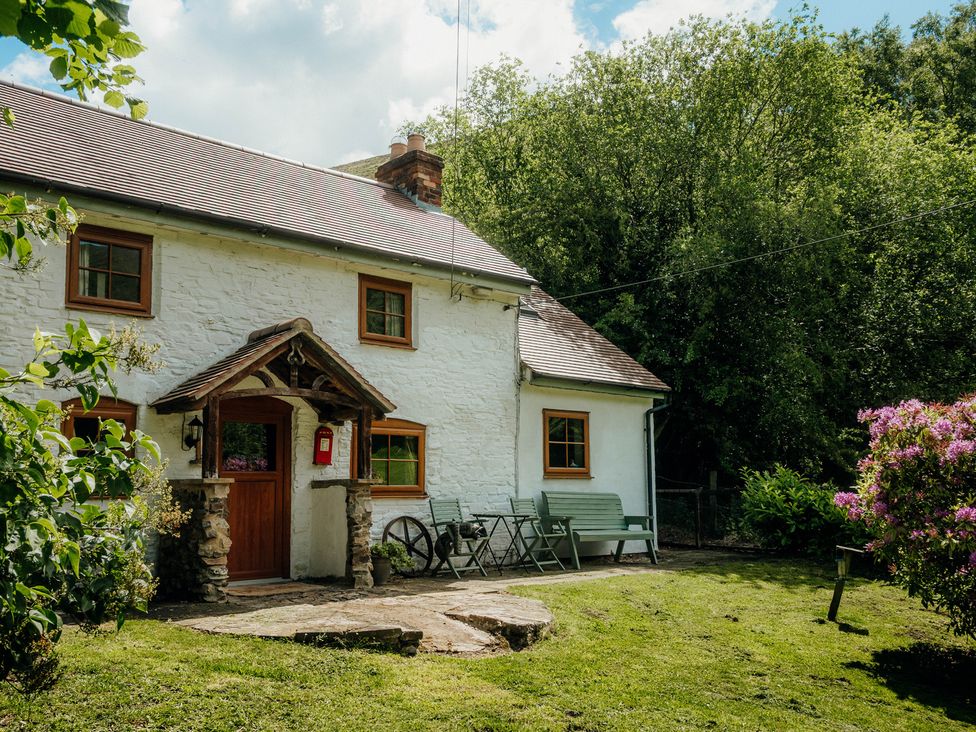 A house with a porch and garden at The Wilderness in Stiperstones