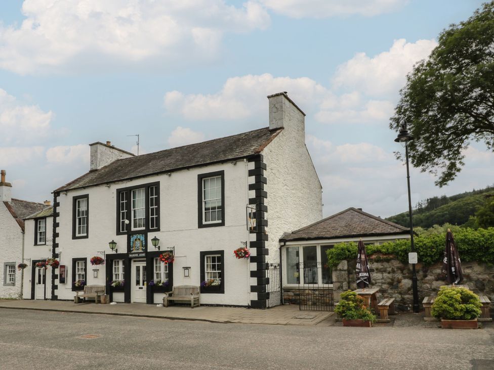 A building with windows and flower pots at 79 Laurel Bank in Gatehouse of Fleet