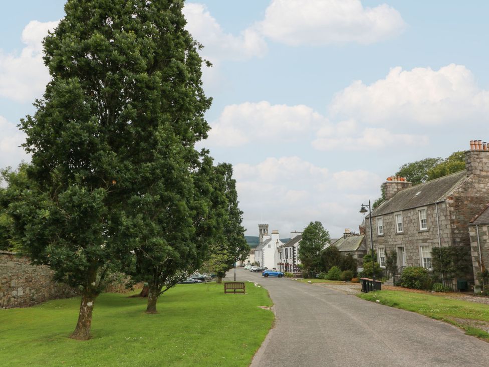 A street view with trees and houses at 79 Laurel Bank, Gatehouse of Fleet