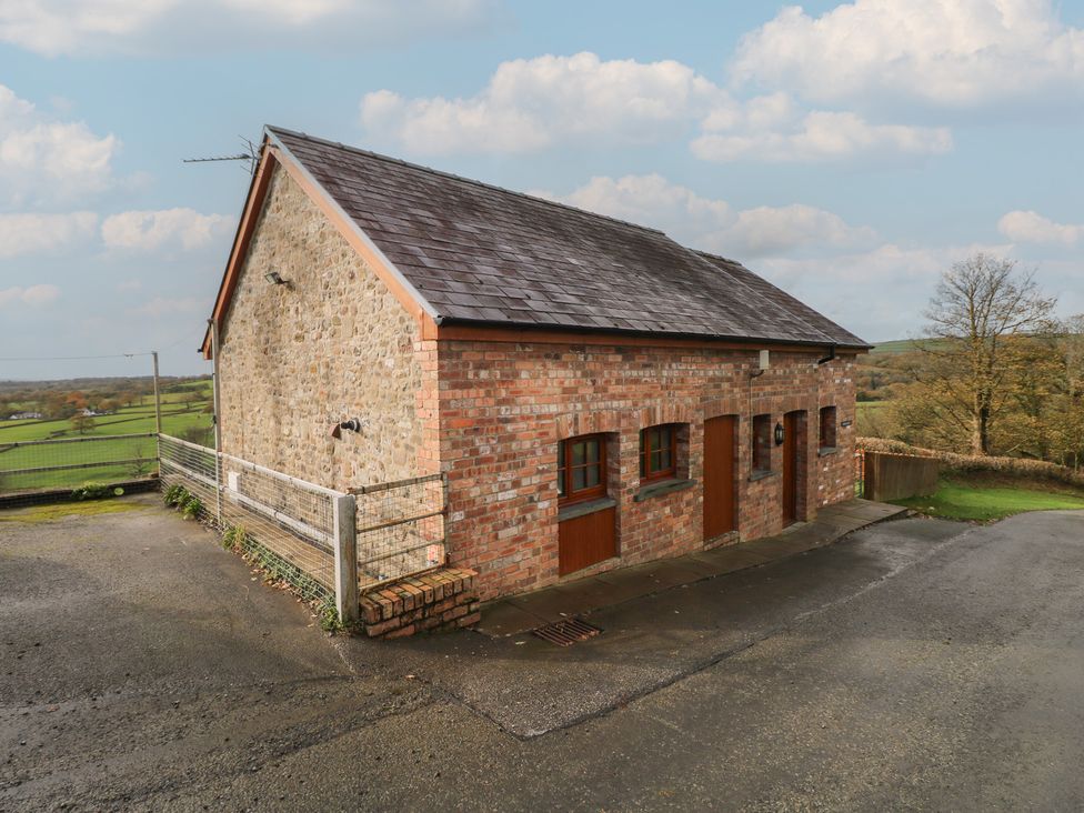 A brick building with windows and doors at Bwthyn-y-Rhiw Penybanc near Llandeilo