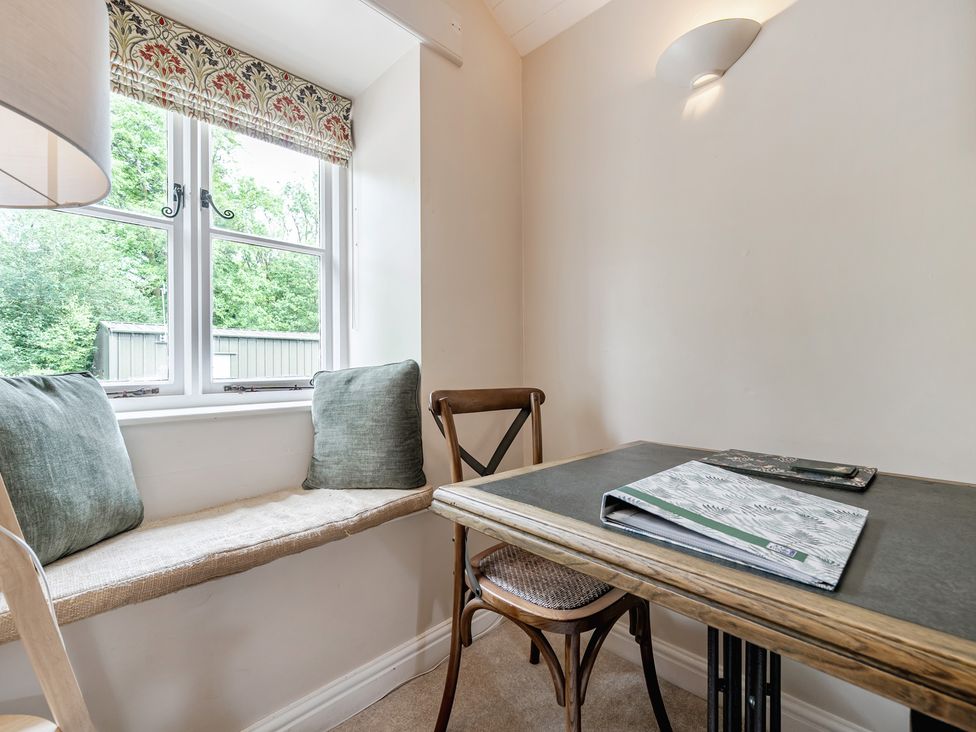 A dining area with a table and chairs at Can Brow at the Graythwaite Estate near Hawkshead