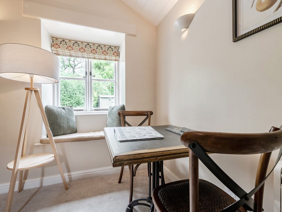 A study with a desk and chair at Can Brow at the Graythwaite Estate near Hawkshead