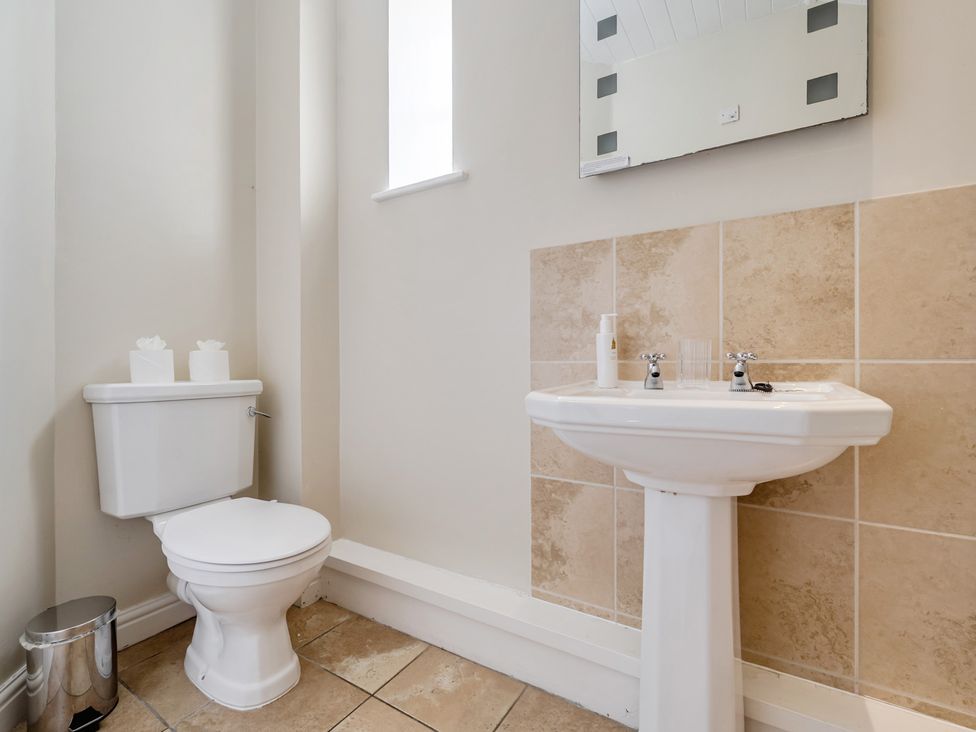 A bathroom with a toilet and sink at Can Brow at the Graythwaite Estate near Hawkshead