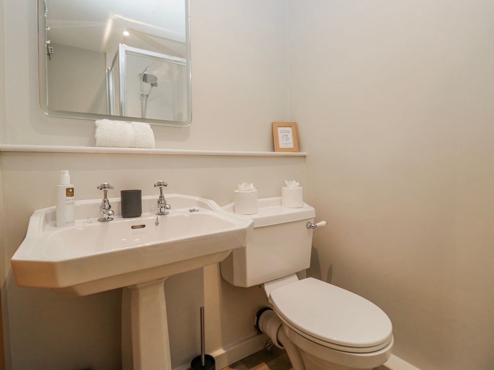 A bathroom with a sink and toilet at Jubilee in Graythwaite near Hawkshead