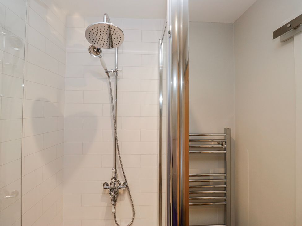 A shower with a towel radiator at Jubilee in Graythwaite near Hawkshead