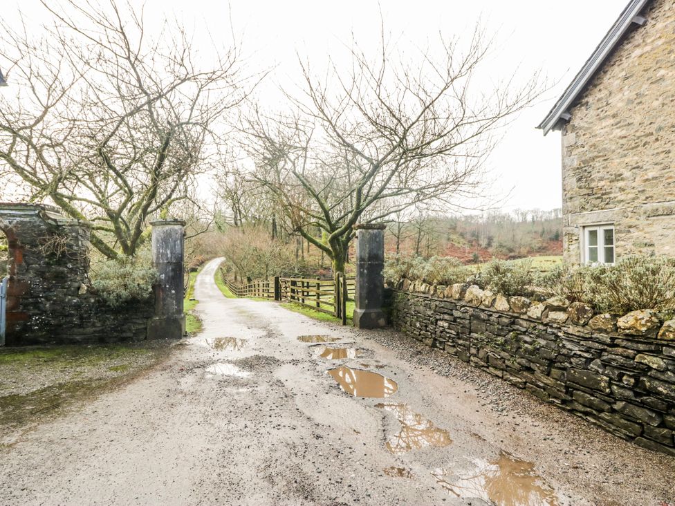 An outdoor view of a gravel pathway leading to a property at Jubilee in Graythwaite near Hawkshead