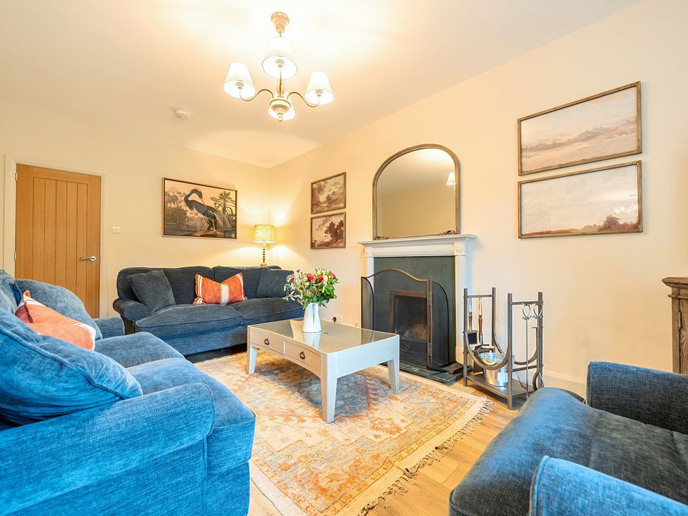 A living room with sofas and a coffee table at Jubilee at the Graythwaite Estate Graythwaite near Hawkshead