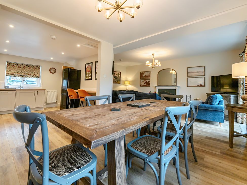 A dining room with a table and chairs at Jubilee at the Graythwaite Estate near Hawkshead
