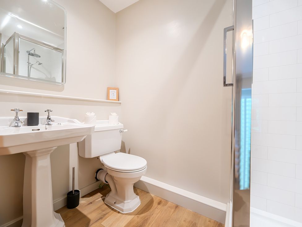 A bathroom featuring a sink, toilet, and shower at Jubilee at the Graythwaite Estate near Hawkshead