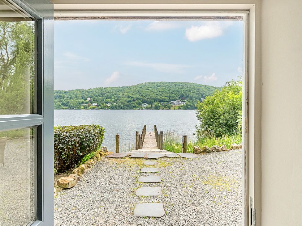 A view of a dock leading to water at Hammerhole at the Graythwaite Estate near Hawkshead