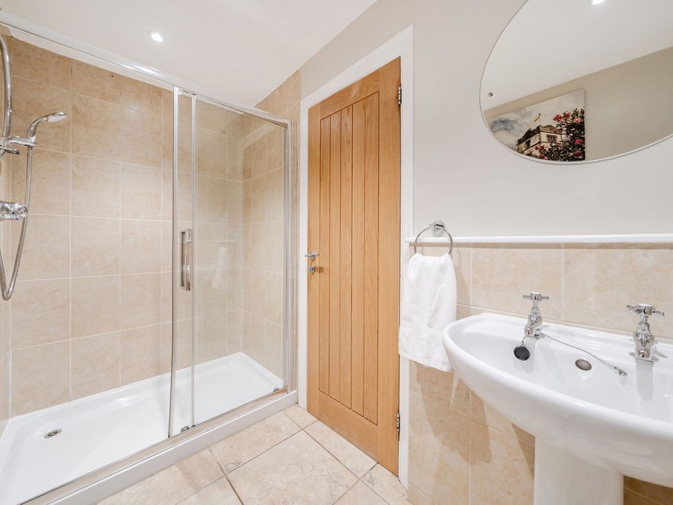 A bathroom with a shower and sink at Hammerhole at the Graythwaite Estate near Hawkshead