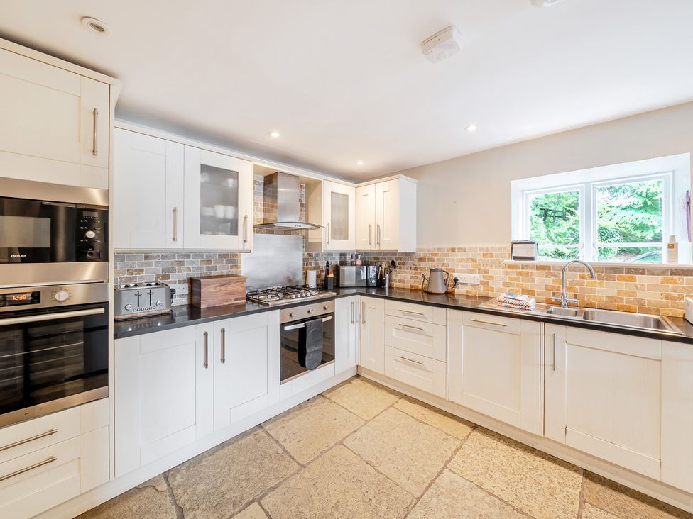 A kitchen with appliances and countertops at Hammerhole at the Graythwaite Estate near Hawkshead