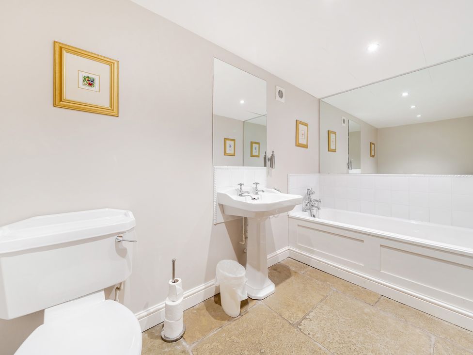 A bathroom with a sink, toilet, and bathtub at Hammerhole at the Graythwaite Estate near Hawkshead