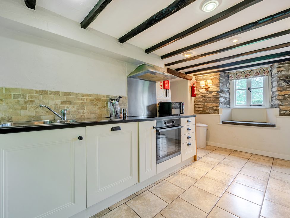 A kitchen with a countertop and appliances at Hullet Hall at the Graythwaite Estate near Hawkshead