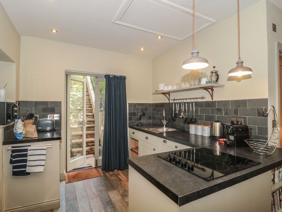 A kitchen with a stove and sink at The Stable in Deepdean near Ross-on-Wye