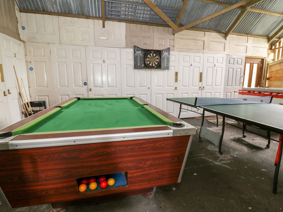 A games room with a pool table and a table tennis table at Cariad Cottage in Cross Inn