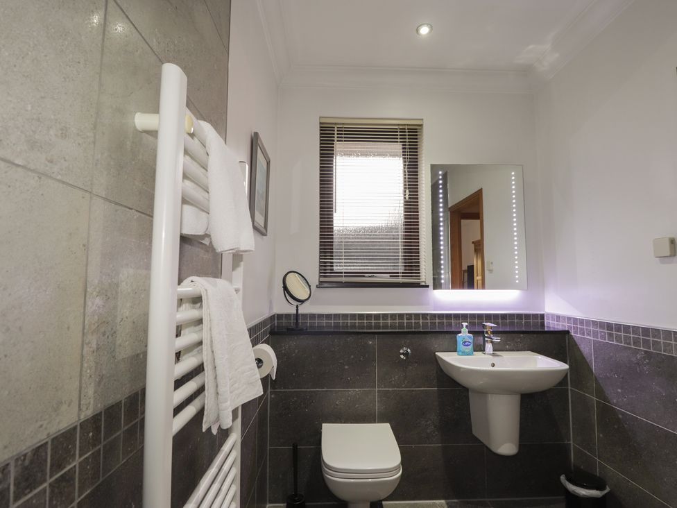 A bathroom with a sink and toilet at Little Chestnut in Muir of Ord