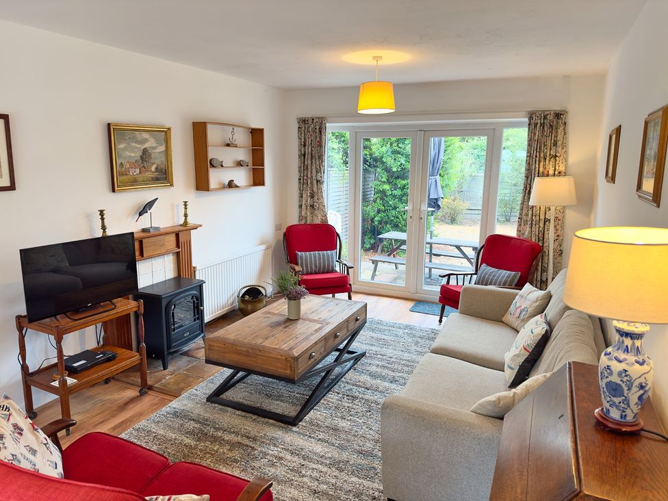 A living room with a coffee table and television at 38 Dale End Brancaster Staithe near Burnham Market