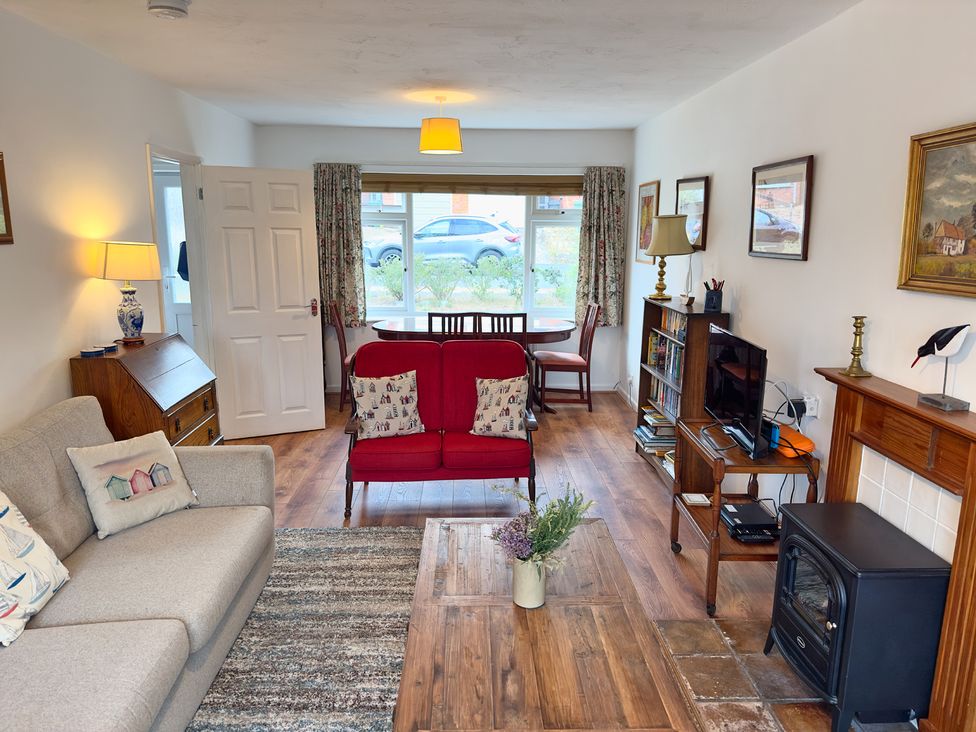 A living room with a sofa and coffee table at 38 Dale End Brancaster Staithe near Burnham Market