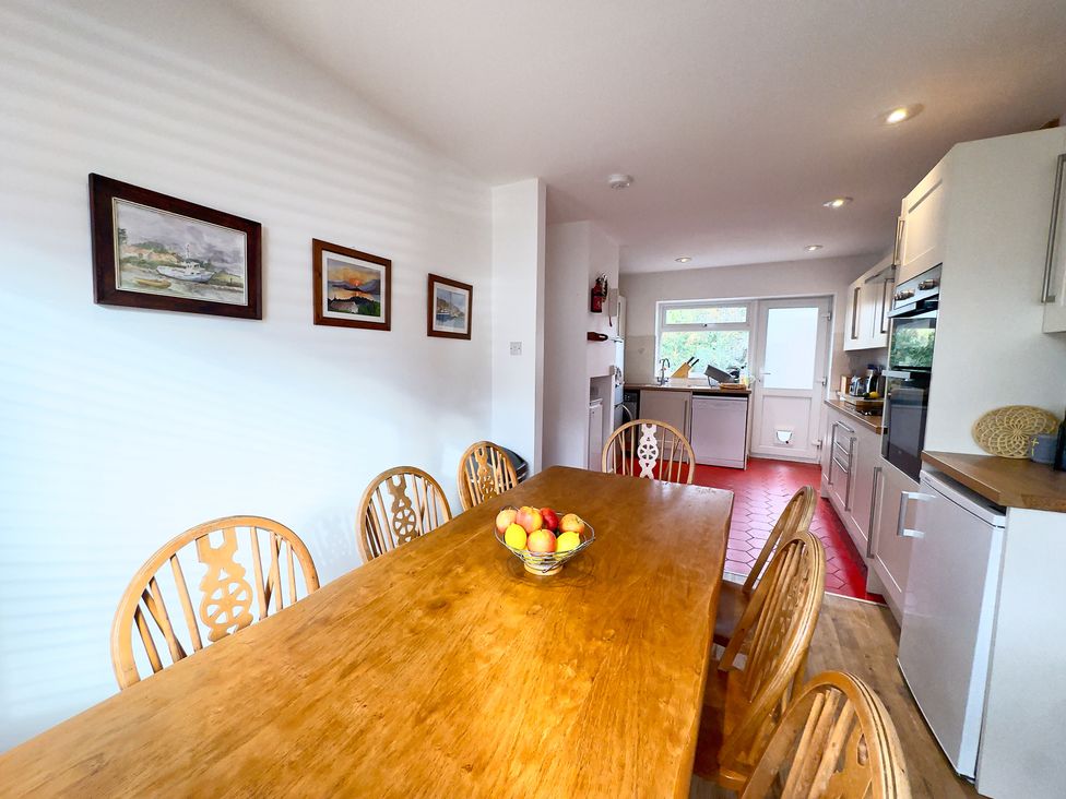 A kitchen with a dining table and chairs at 38 Dale End Brancaster Staithe near Burnham Market