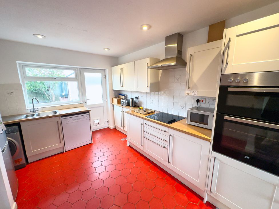 A kitchen with appliances and a sink at 38 Dale End Brancaster Staithe near Burnham Market