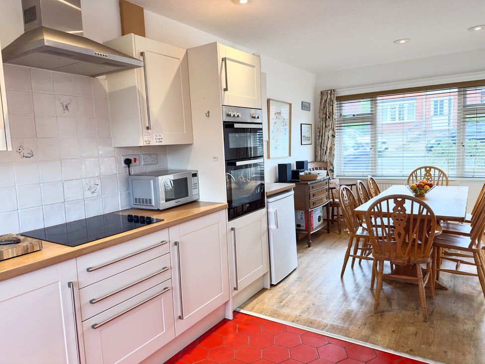 A kitchen with a dining table and chairs at 38 Dale End Brancaster Staithe near Burnham Market