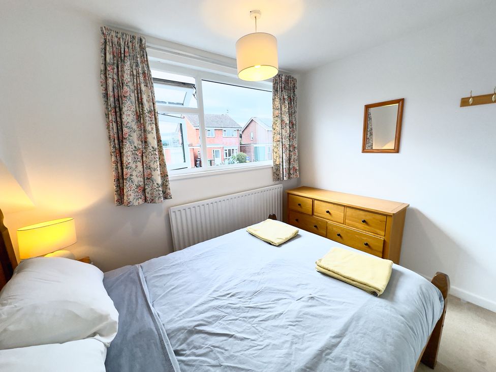 A bedroom with a bed and drawers at 38 Dale End Brancaster Staithe near Burnham Market