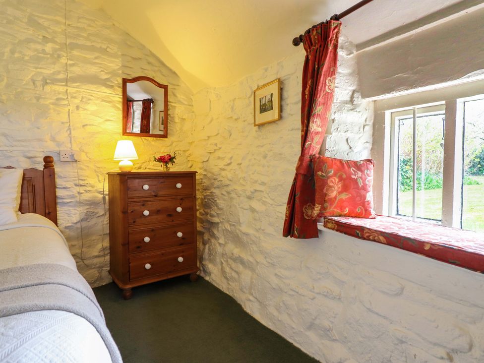 A bedroom with a bed and drawer unit at Penymaes Bronygarth near Chirk