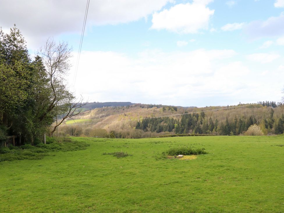 A scenic view of hills and trees in a field at Penymaes in Bronygarth near Chirk