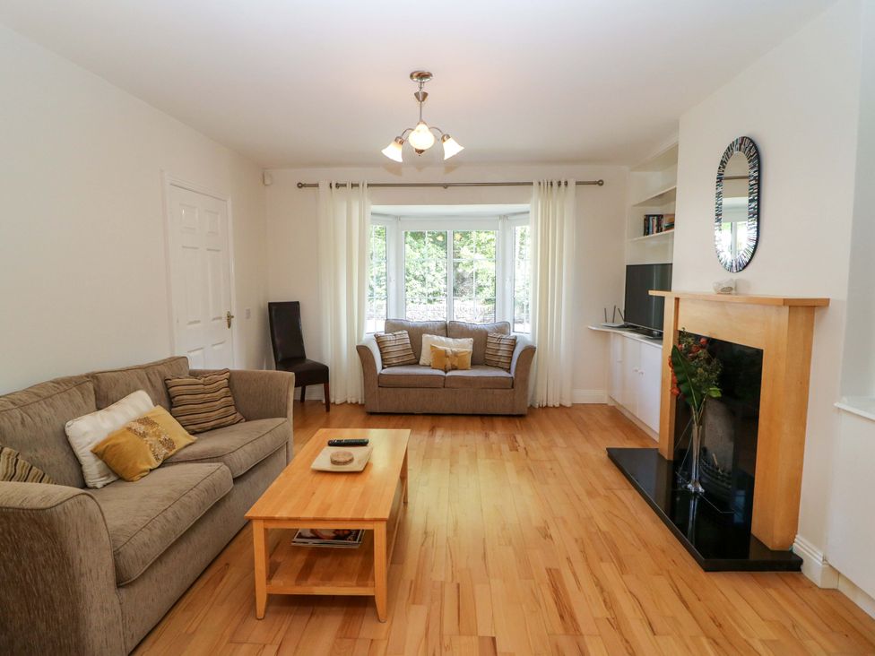 A living room with a sofa and coffee table at No. 4 Lansdowne Village, Kenmare, The Ring of Kerry, County Kerry