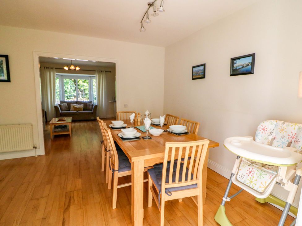 A dining room with a table set for meal at No. 4 Lansdowne Village, Kenmare, The Ring of Kerry, County Kerry