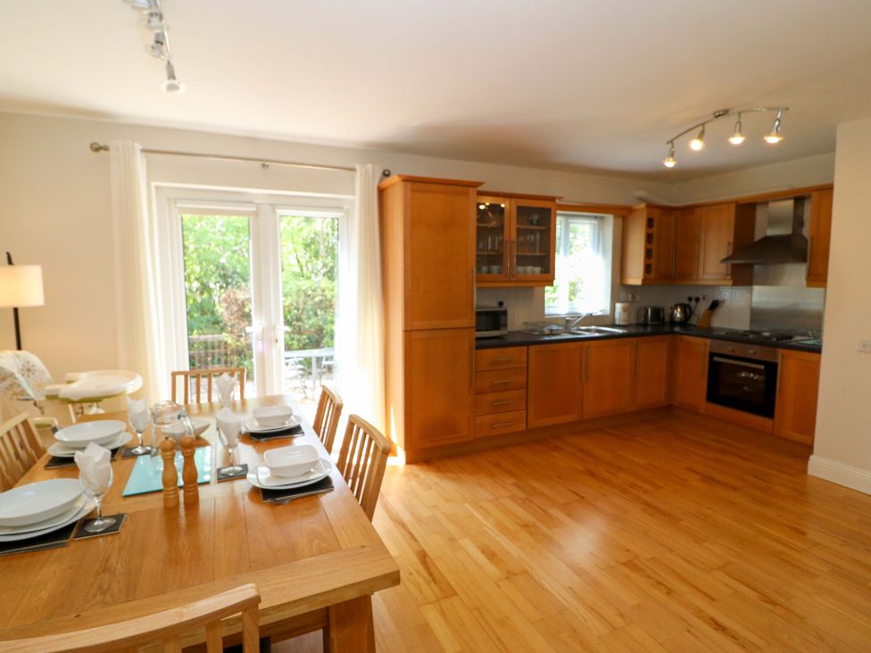 A kitchen with a dining area and appliances at No. 4 Lansdowne Village, Kenmare, The Ring of Kerry, County Kerry