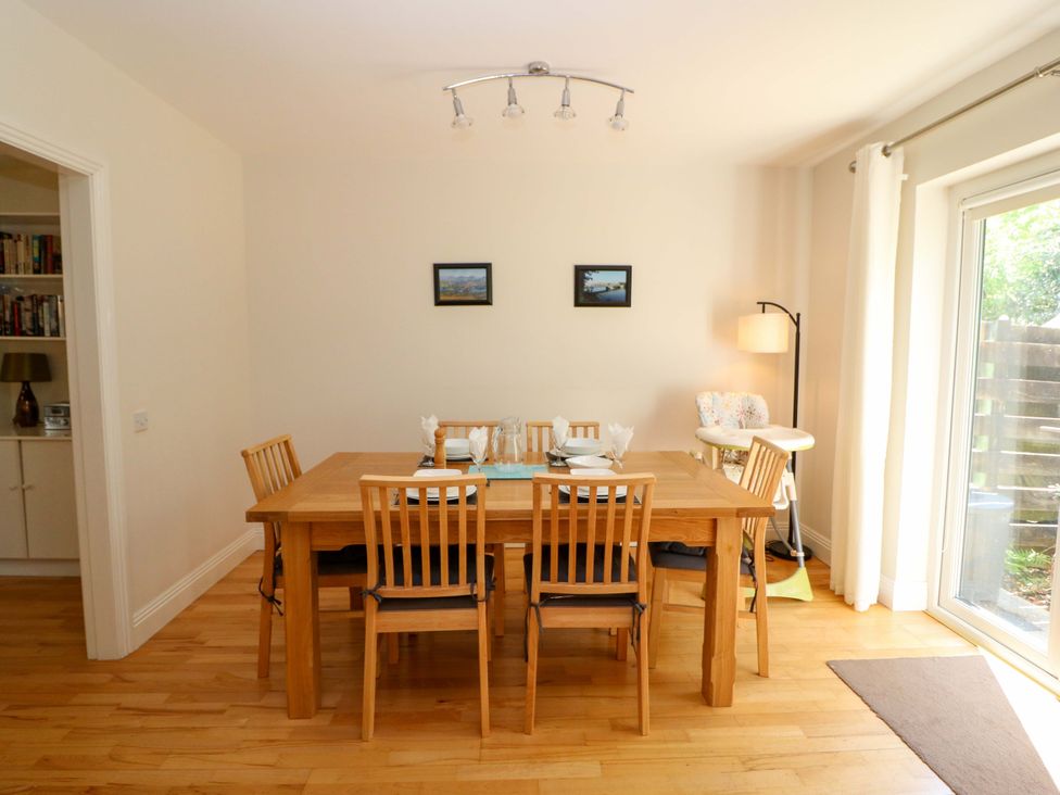 A dining room with a table and chairs at No. 4 Lansdowne Village, Kenmare, The Ring of Kerry, County Kerry