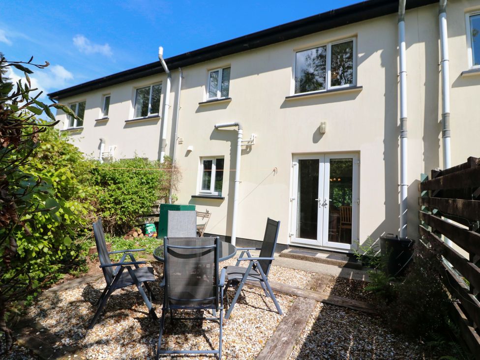 An outdoor area with a patio and dining table at No. 4 Lansdowne Village, Kenmare, The Ring of Kerry, County Kerry