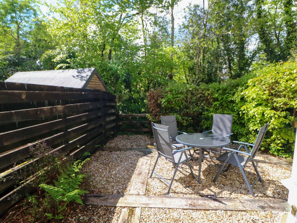 A garden with a table and chairs at No. 4 Lansdowne Village Kenmare, The Ring of Kerry, County Kerry