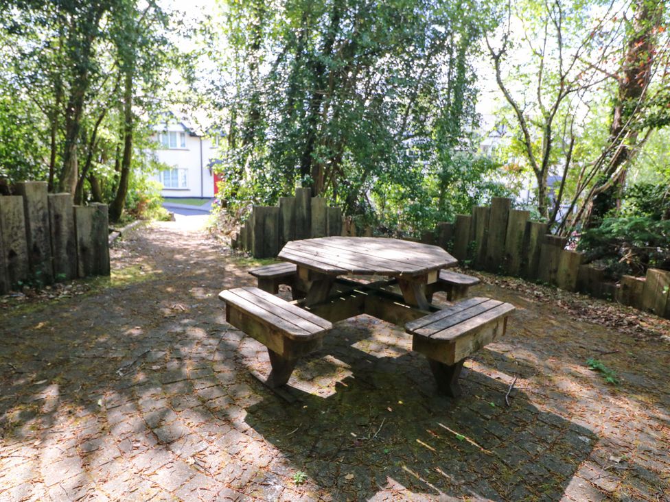 A picnic table and benches in a garden at No. 4 Lansdowne Village, Kenmare, The Ring of Kerry, County Kerry
