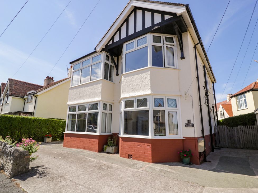 A house with bay windows and a driveway at Meadway House in Rhos-on-Sea
