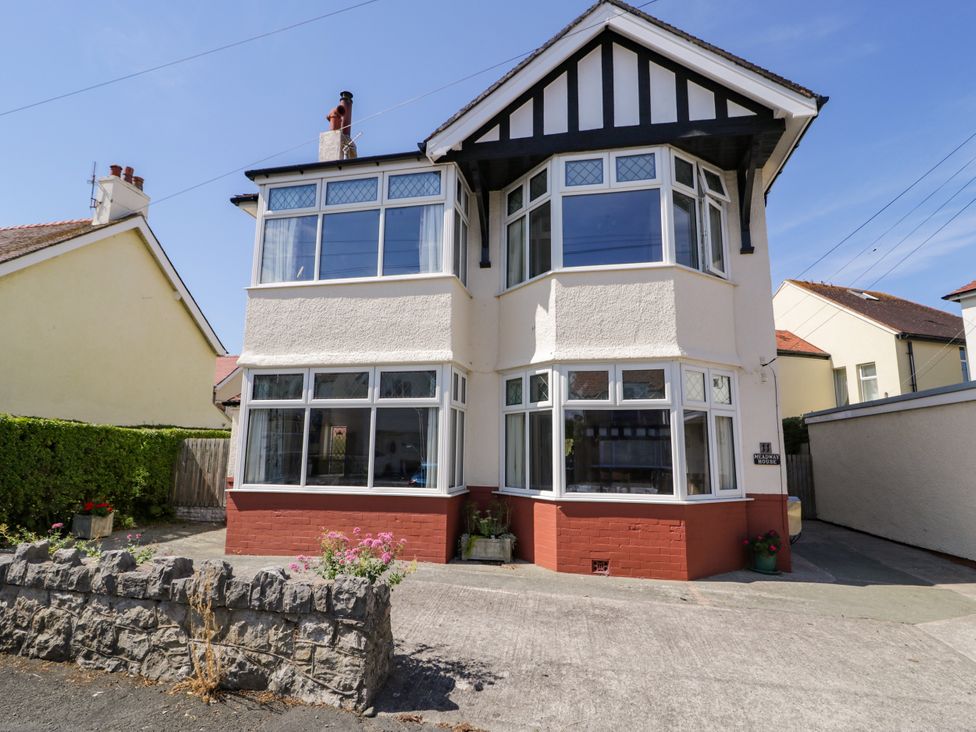 A house with large windows and garden at Meadway House in Rhos-on-Sea