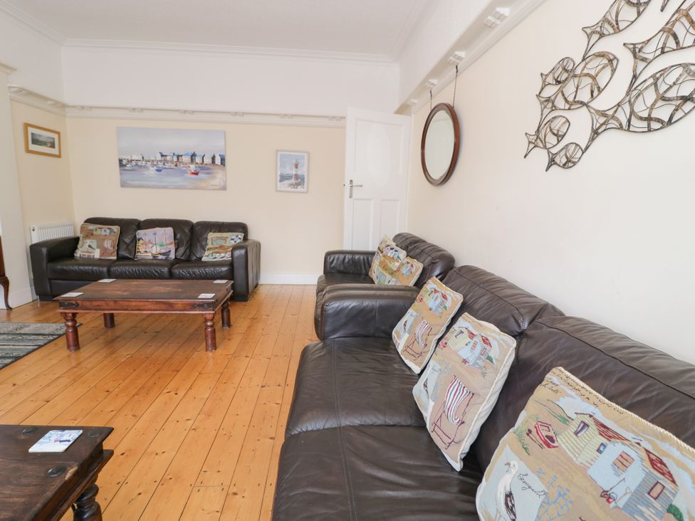 A living room with sofas and a coffee table at Meadway House Rhos-on-Sea