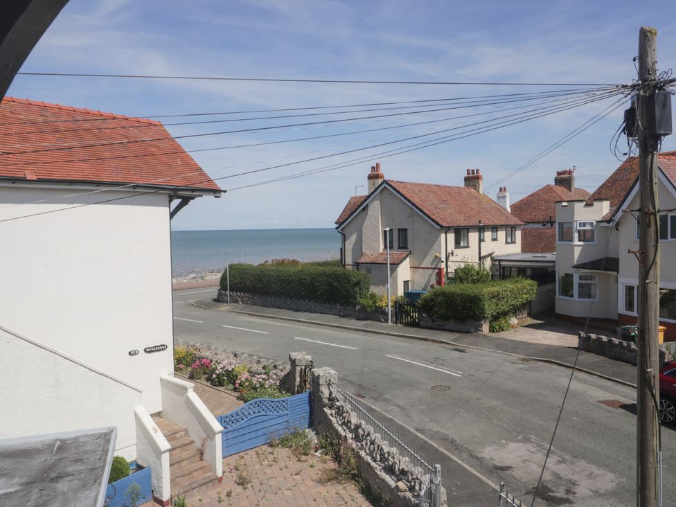 View of houses and sea from the street at Meadway House in Rhos-on-Sea