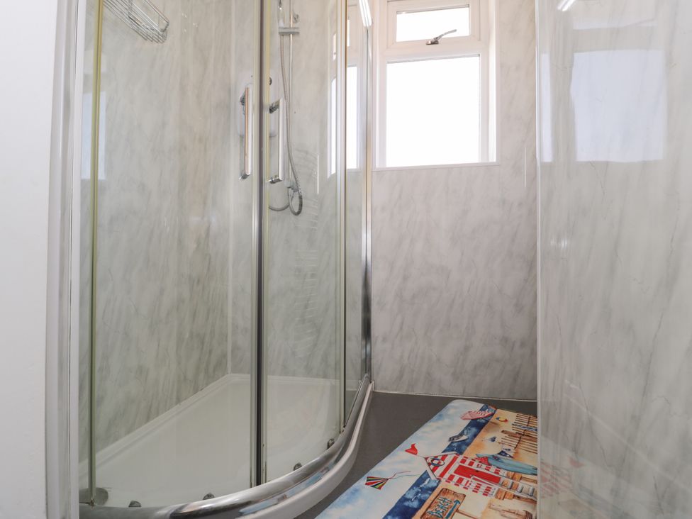 A shower area with a mat in a bathroom at Meadway House Rhos-on-Sea