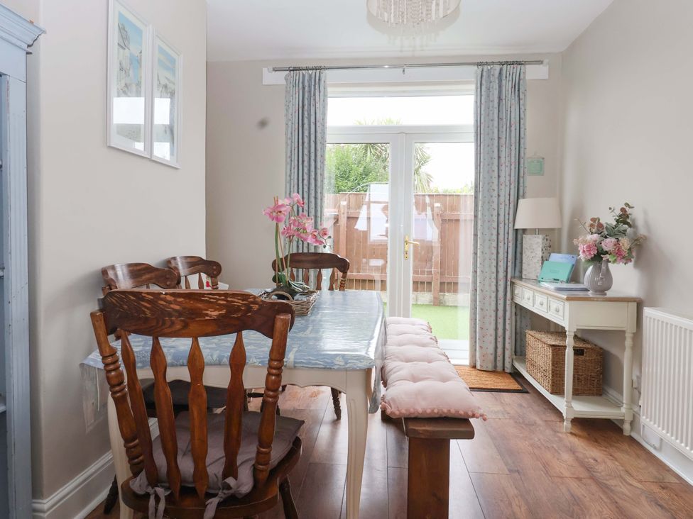 A dining room with a table and chairs at Sea View House in Hornsea