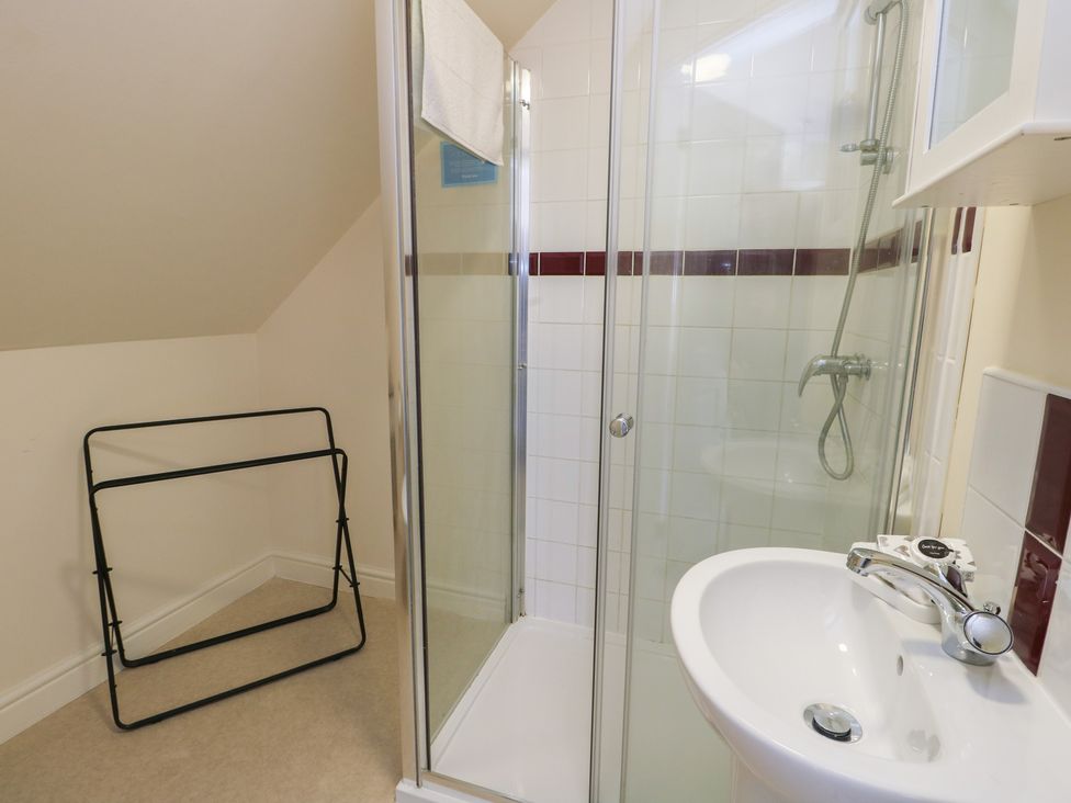 A bathroom with a shower and sink at Ty Ni in Caeathro near Caernarfon