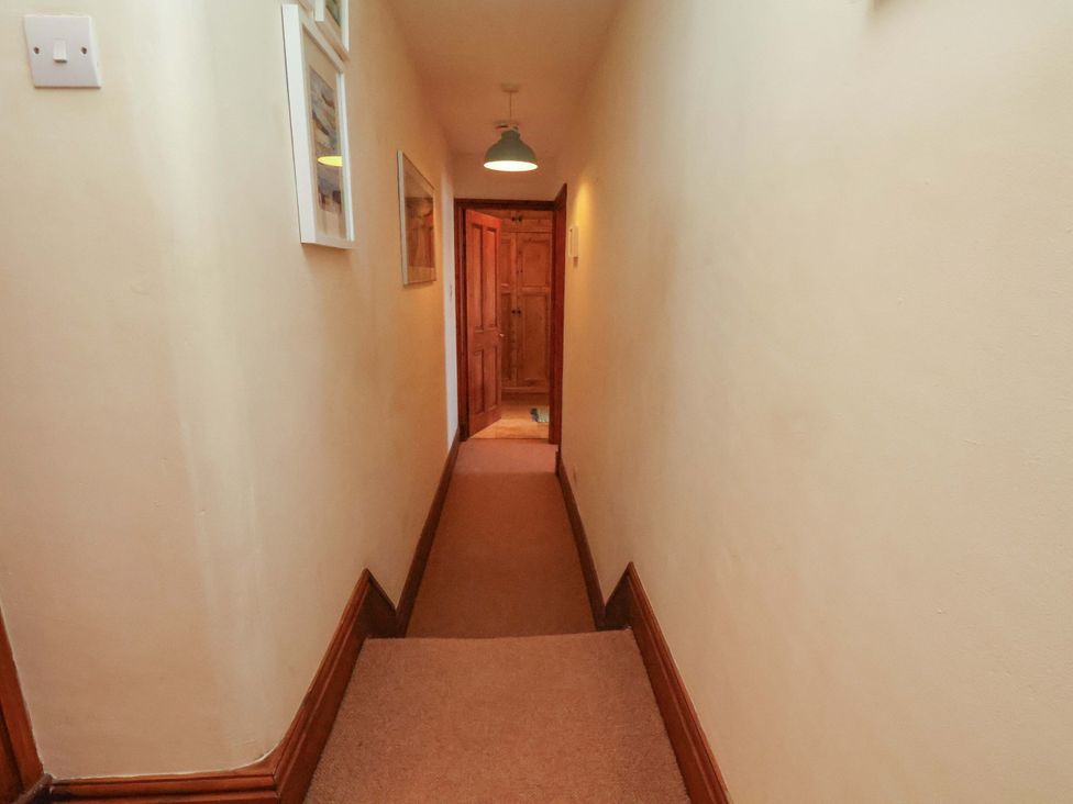 A hallway with a door at 4 Cliff Cottages Port Mulgrave near Staithes