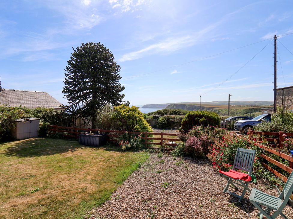 A garden with a view of the coastline at 4 Cliff Cottages Port Mulgrave near Staithes